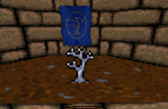 Screenshot of the Silver Sapling against a dungeon background, in front of the Silver Sapling standard