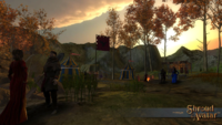 Screenshot of a medieval camp, including several figures. The sun hangs low.