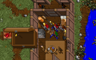Screenshot from Ultima VII of a party opening a chest. A large depiction of the contents of the chest appears inset.